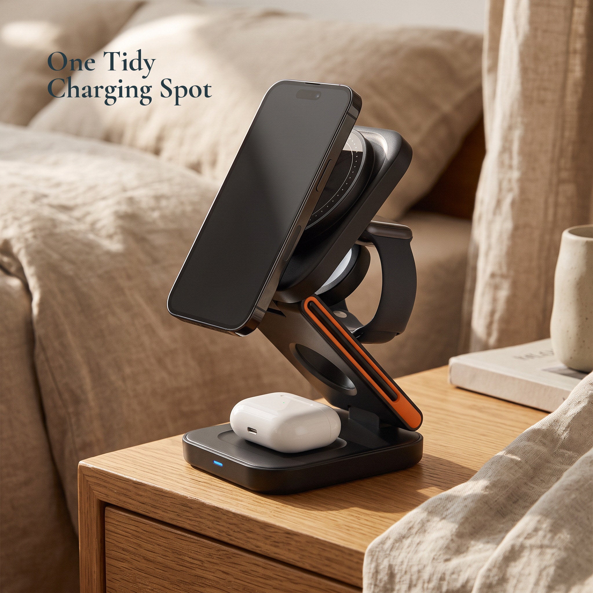 Black magnetic station with orange watch arm